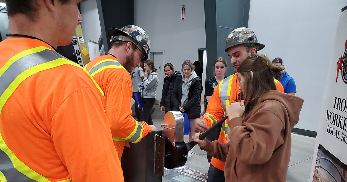 Workers testing out machine