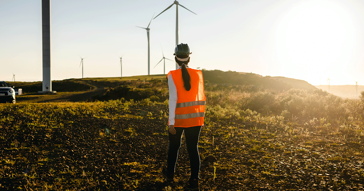 engineering company worker walks on wind farm