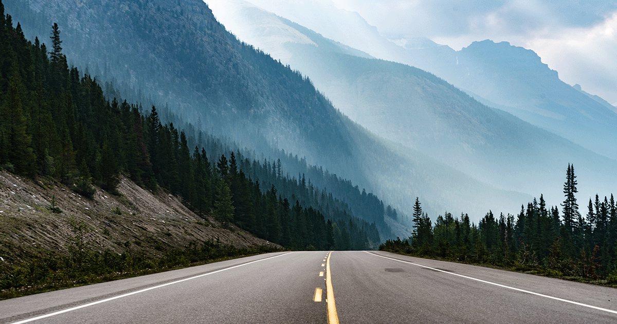roadway leading a journey through the mountains