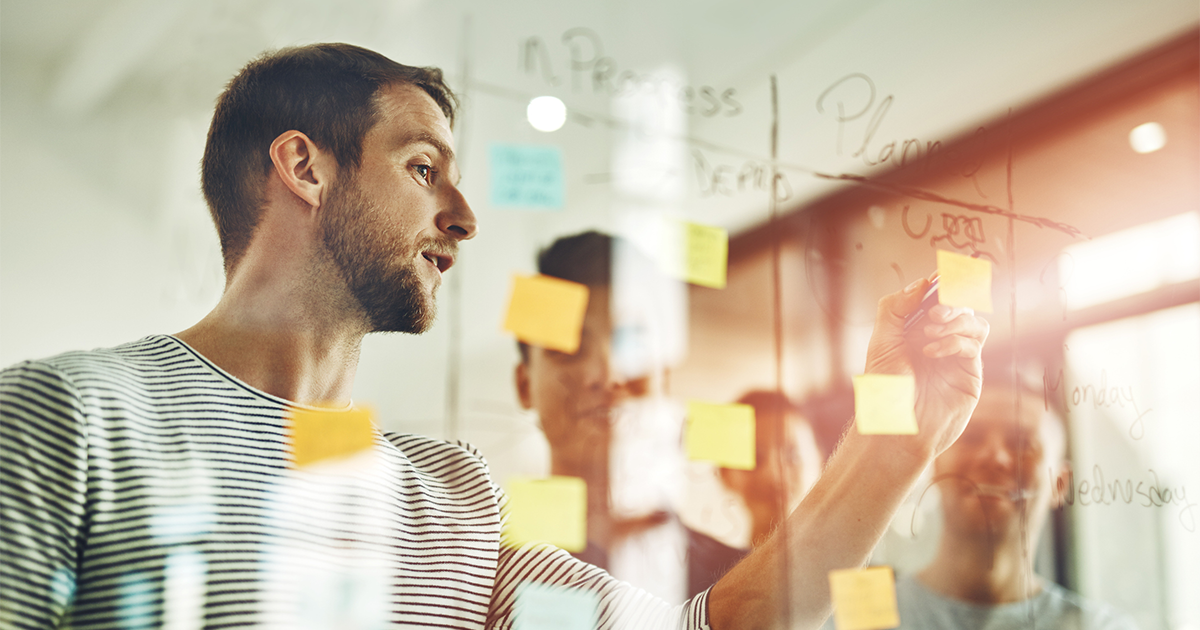 young designers using sticky notes during a brainstorming session