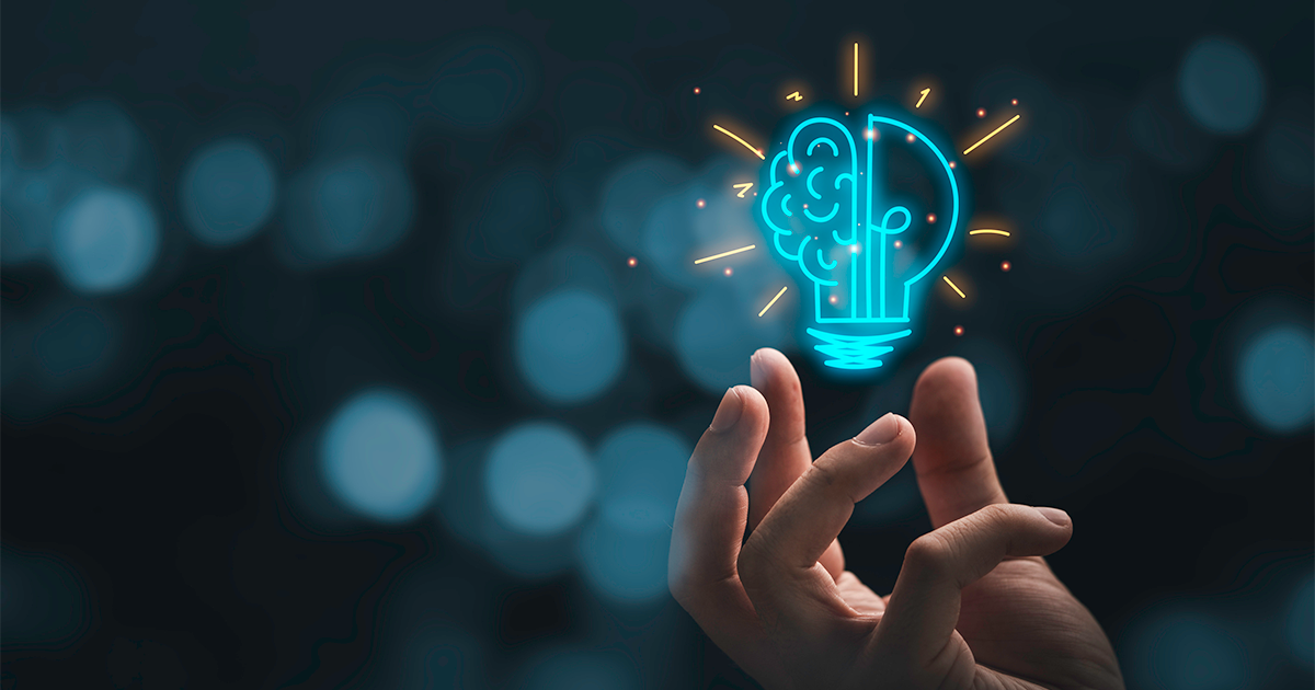 Hand holding drawing virtual lightbulb with brain on bokeh background for creative and smart thinking idea concep