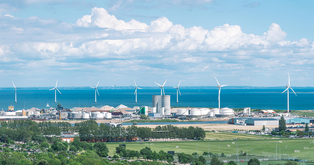 Areal view of offshore wind turbines power in a row
