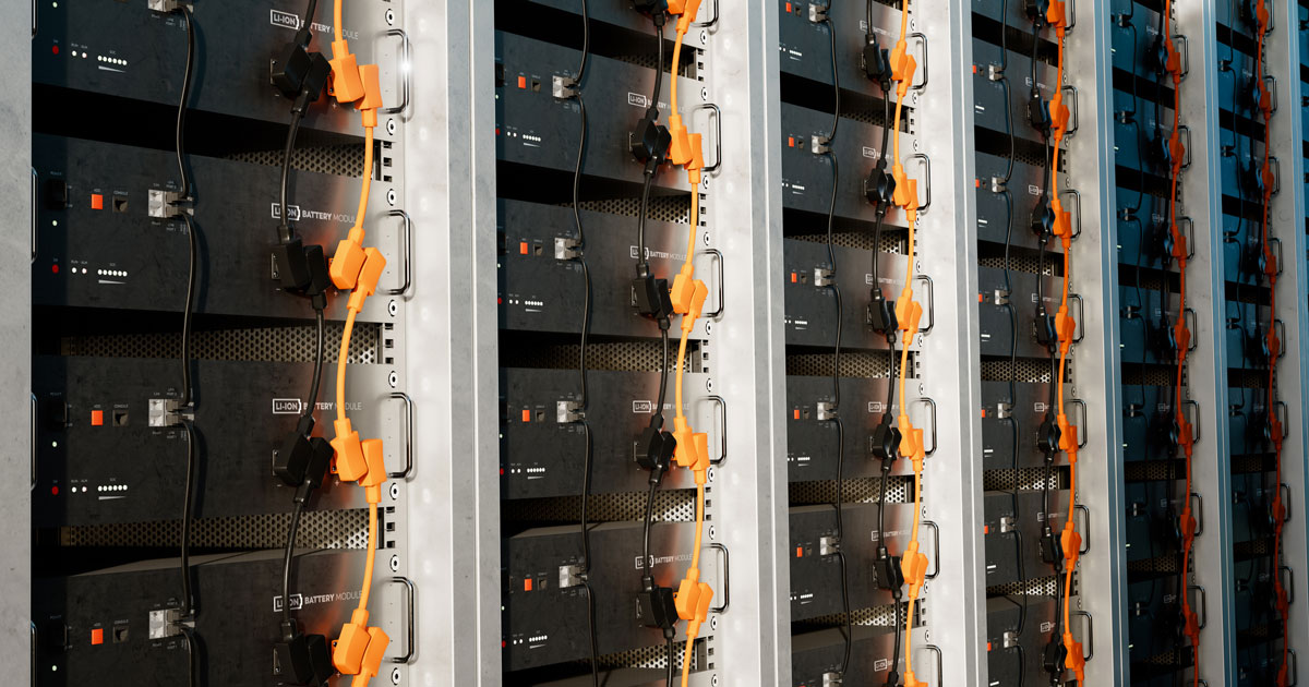 Image of a battery energy storage system consisting of several lithium battery modules placed side by side. This system is used to store renewable energy and then use it when needed. 3d rendering.
