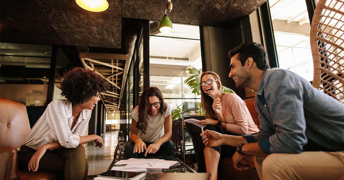 Team of corporate professionals having friendly discussion