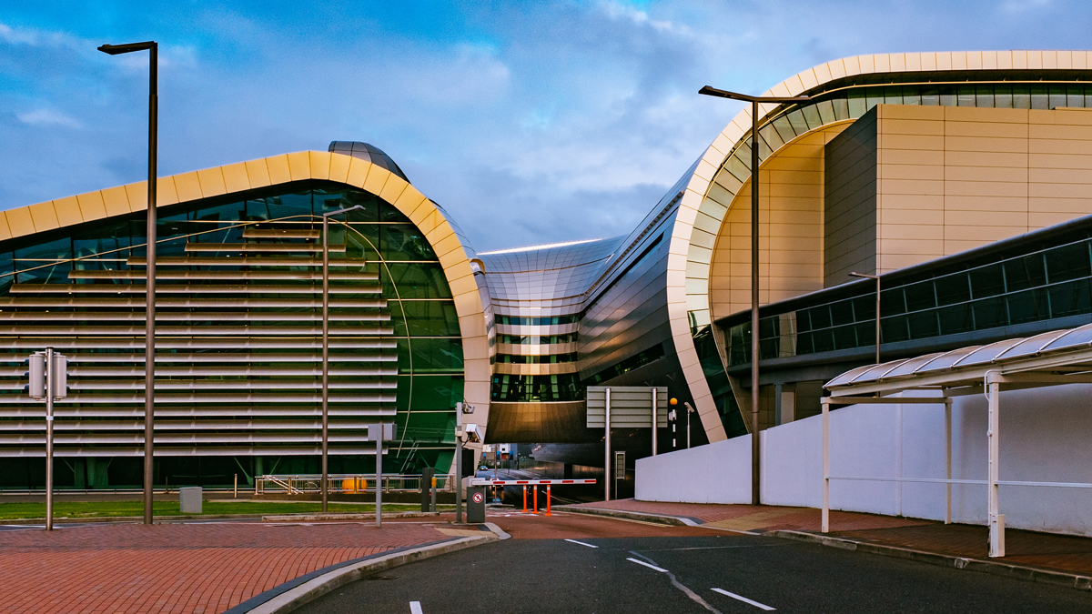 Street By Dublin Airport Against Cloudy Sky