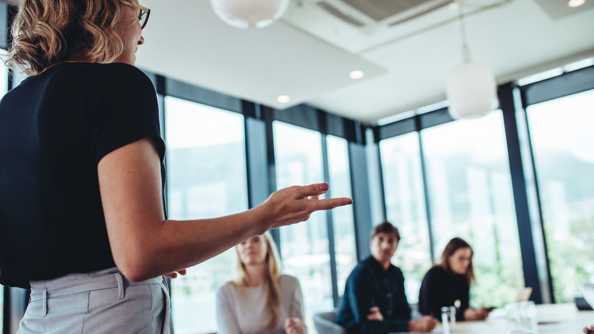 Businesswoman making a presentation to her colleagues in office