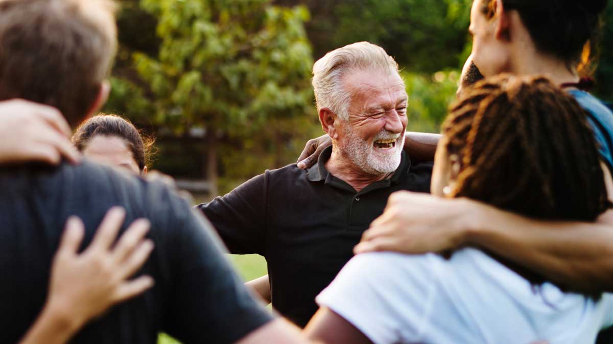 Happiness group of people huddle and smiling together