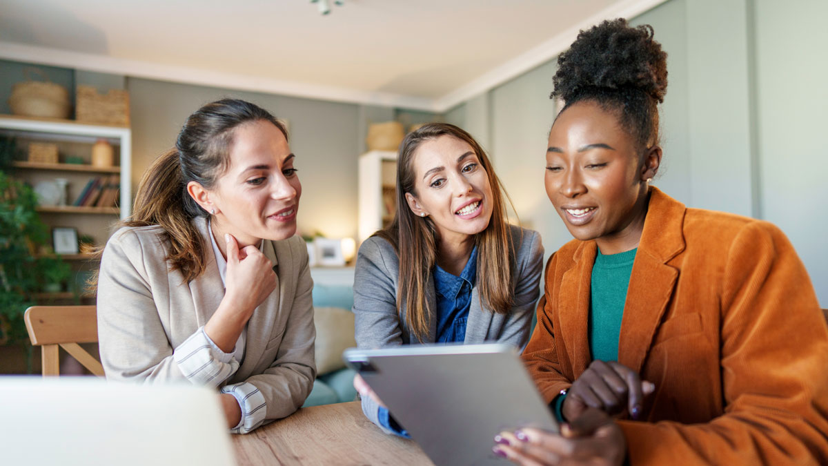 Diverse Female Entrepreneurs Engage in Small Business Planning at Home