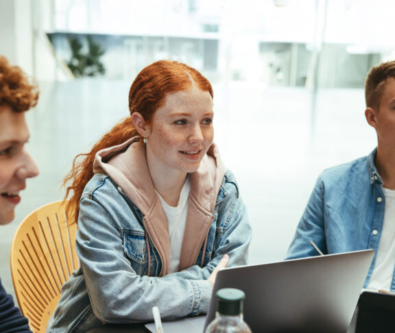 Group of friends working on a college assignment