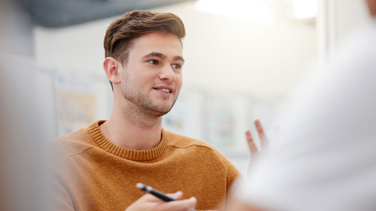 Leadership, mentor or student man presenter in workshop for education, learning or teaching in classroom. Collaboration, training or teamwork at school, college or university library for research