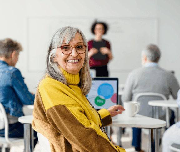 Portrait of senior attending computer and technology education class.