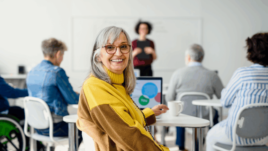 Portrait of senior attending computer and technology education class.