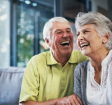 When youre laughing, youre living. Shot of a happy senior couple relaxing together on the sofa at home