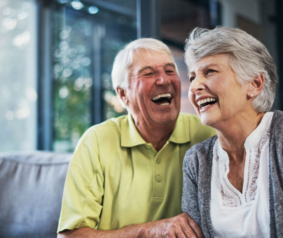 When youre laughing, youre living. Shot of a happy senior couple relaxing together on the sofa at home