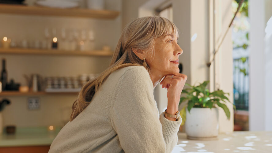 Window, smile and elderly woman with thinking at home for retirement, satisfaction and peace on weekend. Relax, senior person and calm with idea for reflection, mindfulness and good memory in house