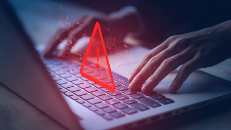 System hacked warning alert on notebook (Laptop). Cyber attack on computer network, Virus, Spyware, Malware or Malicious software. Cyber security and cybercrime. Compromised information internet