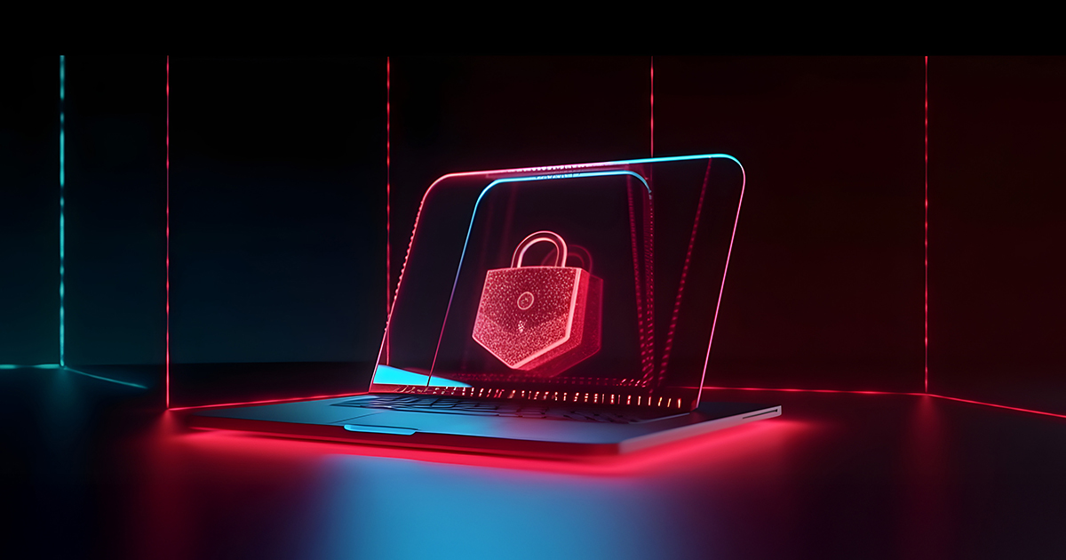Laptop z hologramem kłódki symbolizujący ochronę przed atakami ransomware