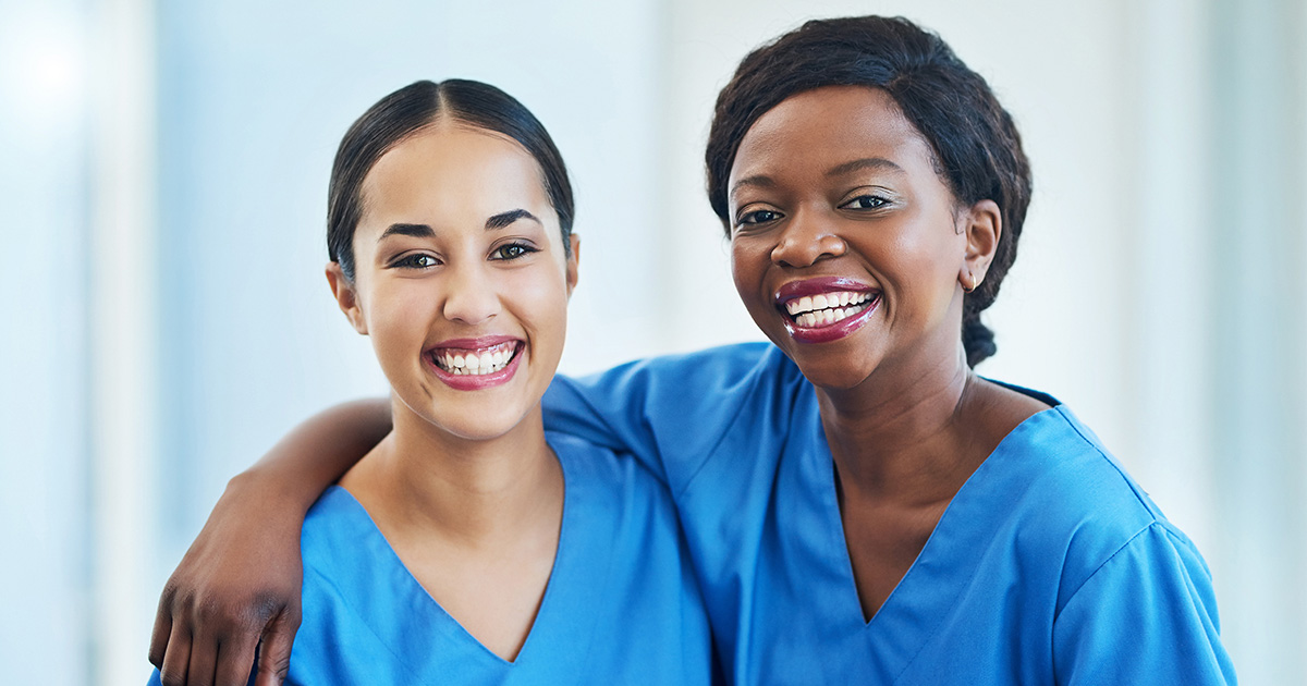 Two smiling nurses