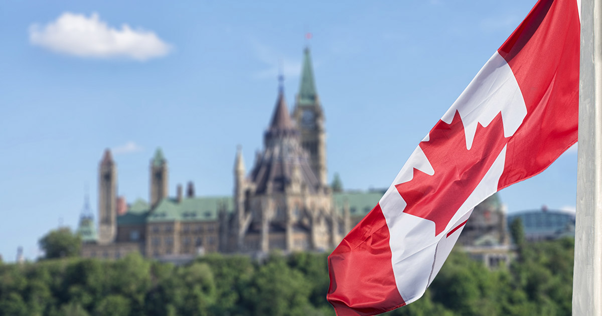 Canadian flag fluttering in front of Carleton University