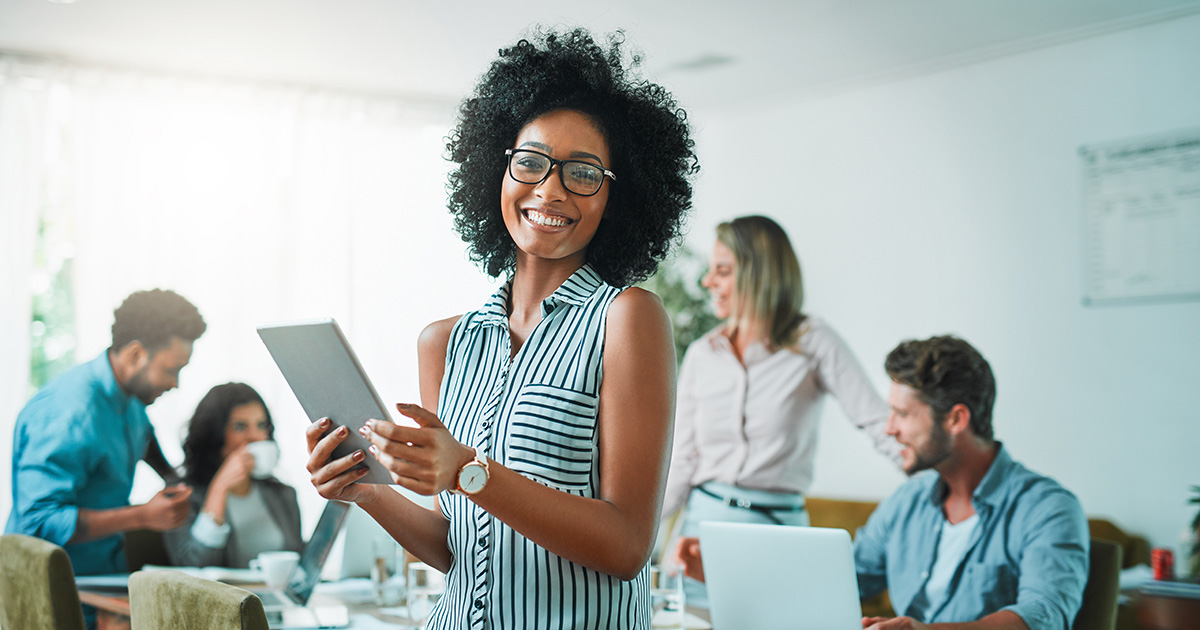Smiling woman with a tablet