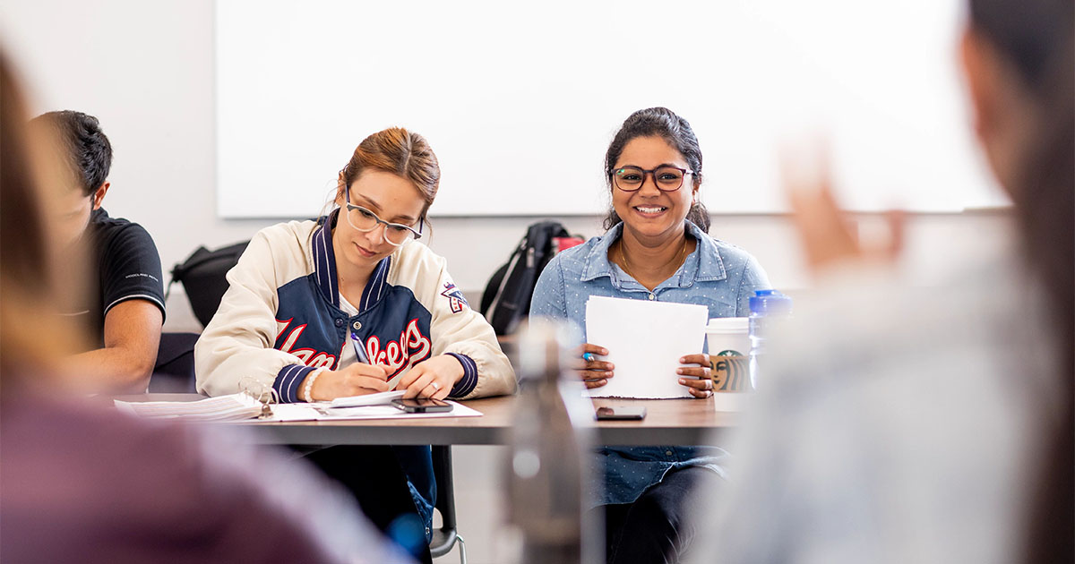 two female students in classroom nait