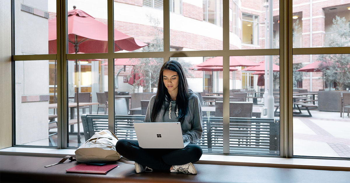 woman using microsoft laptop