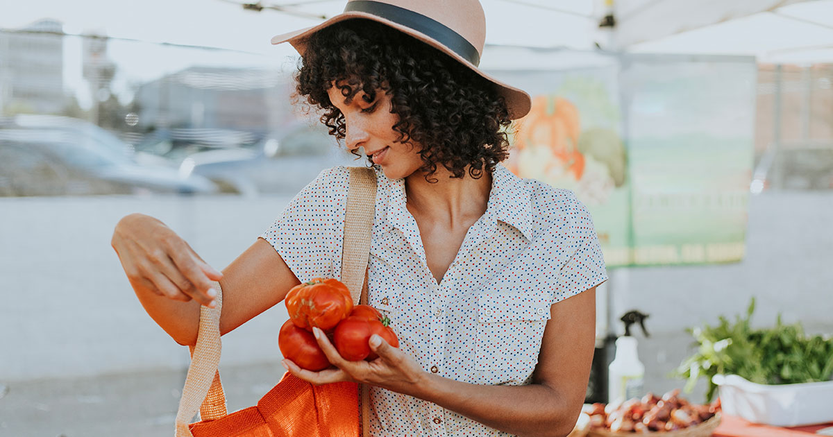 Woman buying tomatoes
