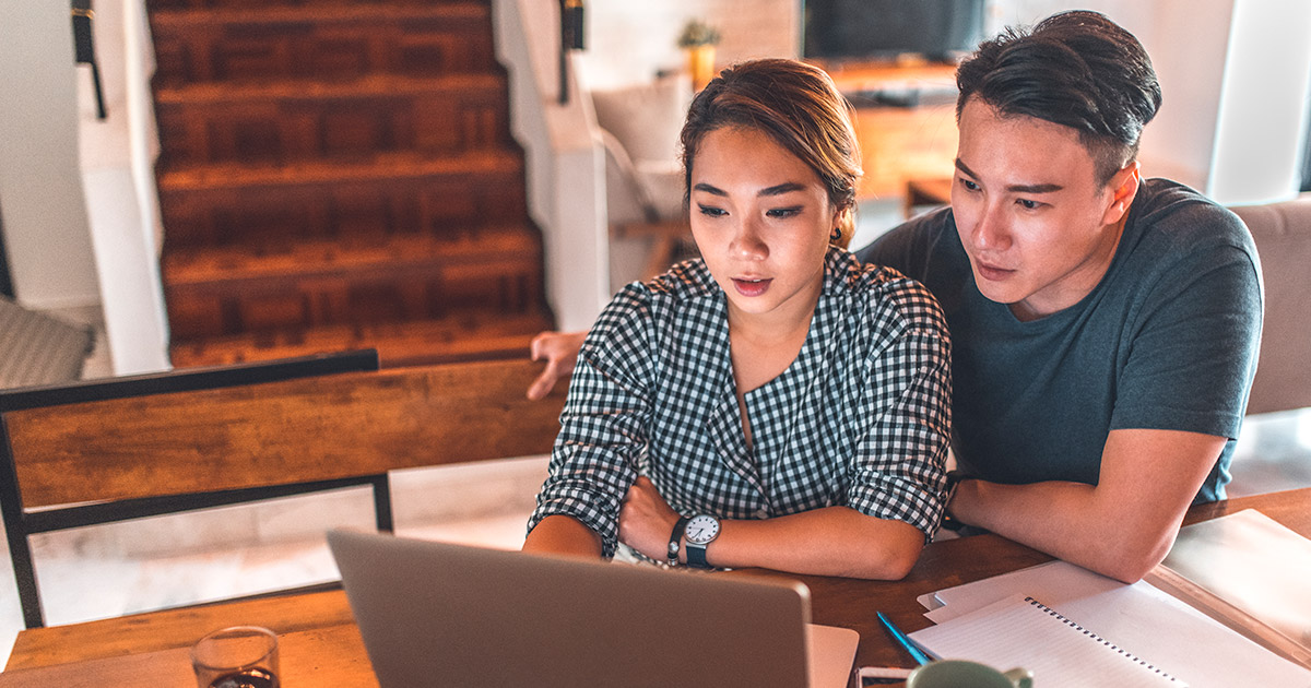 Couple in front of a computer