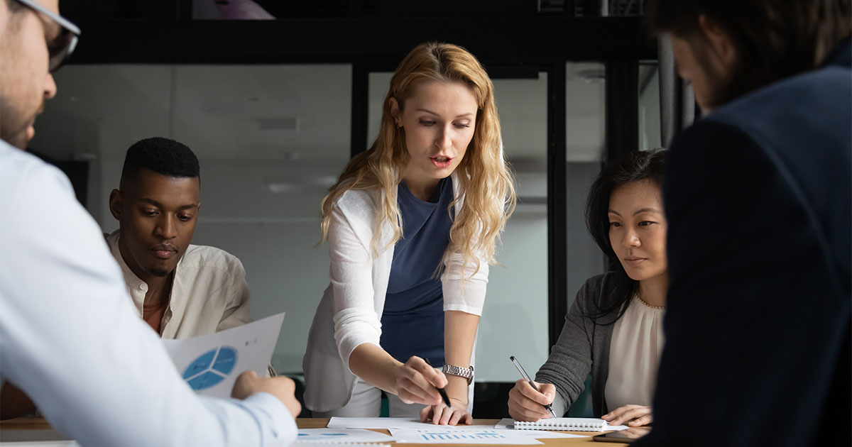 woman leading meeting in office