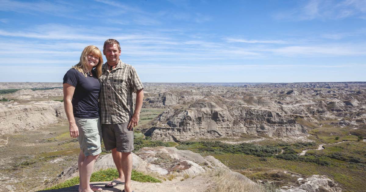 man and woman looking over national park
