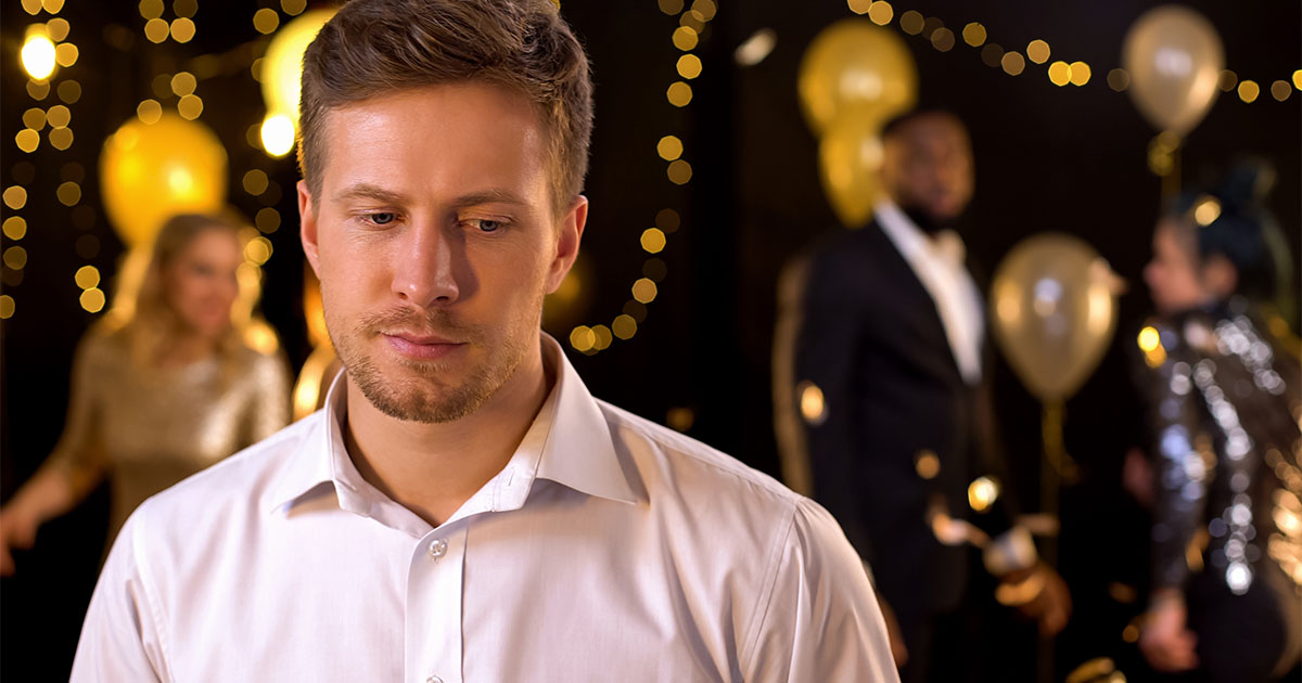 Man with a sad expression while at a party_Atlas