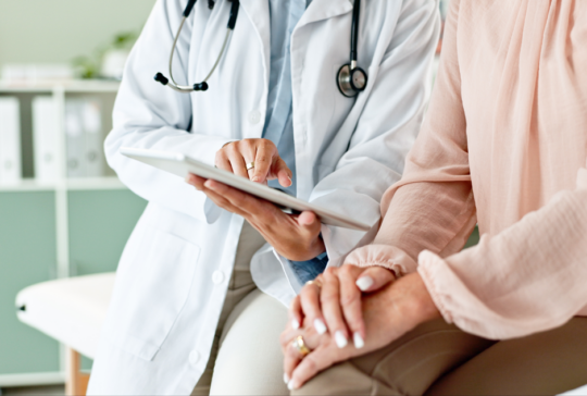 Clinic, tablet and hands of doctor with patient for consulting, medical service and help in hospital. Healthcare, telehealth and people on digital tech for diagnosis, online results and insurance