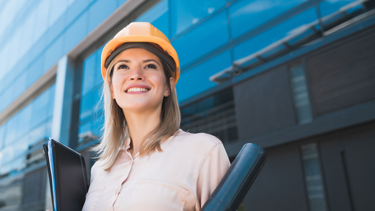 Professional architect woman standing outdoors.