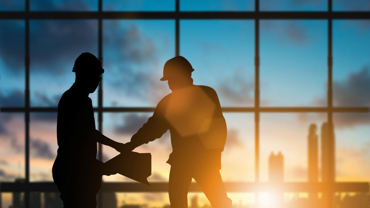 Silhouette engineer standing orders for construction crews to work safely on high ground over blurred natural background sunset pastel. heavy industry and safety at work concept