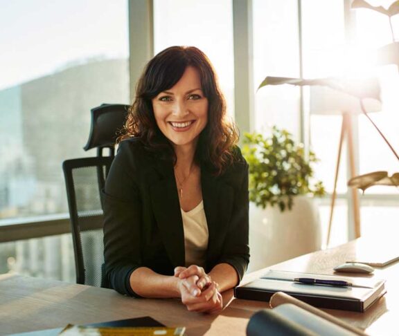 Young woman at her modern workplace