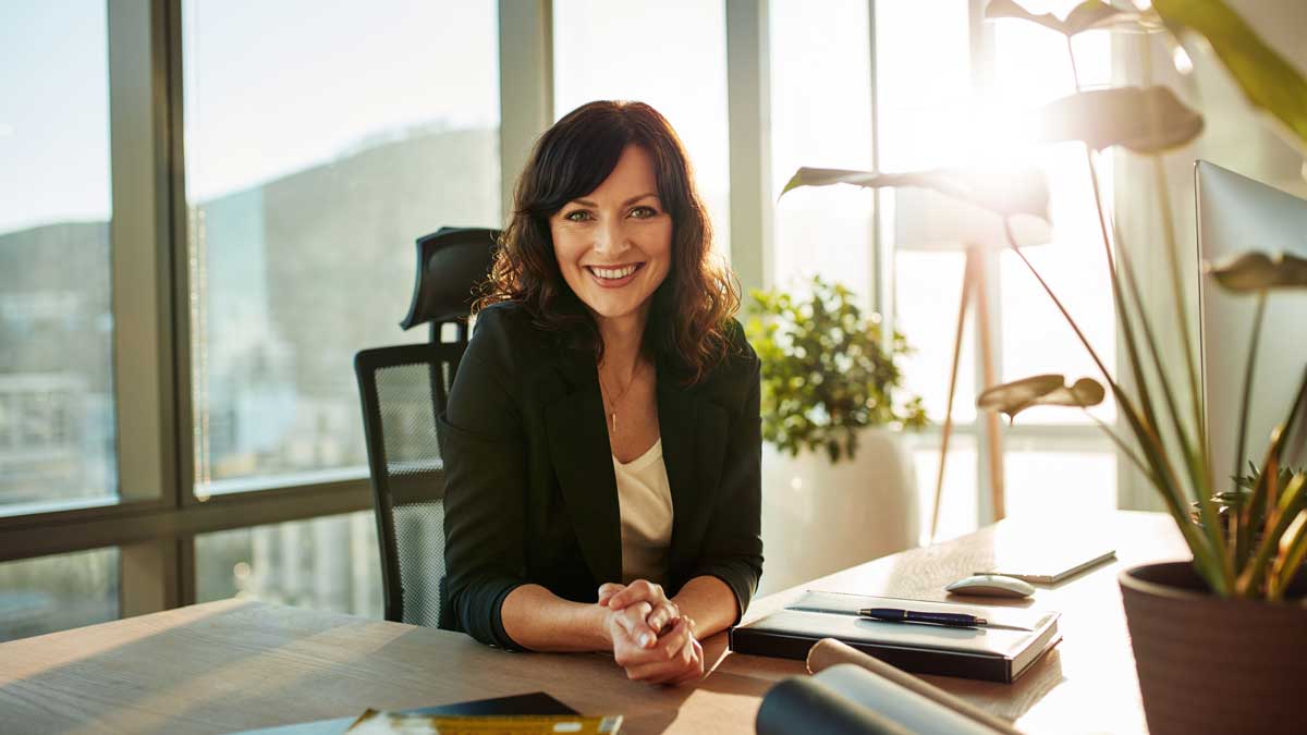 Young woman at her modern workplace