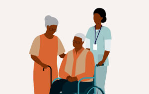 Black Senior Wife With Her Senior Husband In Wheelchair Is Being Taken Care By A Female Nurse