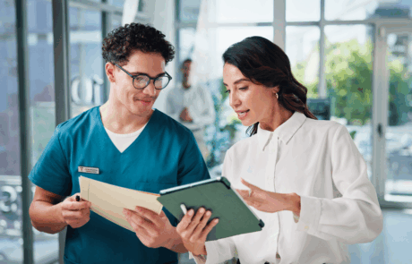 Doctors, conversation and people in hospital, tablet and teamwork with email for treatment approval. Employees, coworking and medical with healthcare, discussion and tech with results and schedule
