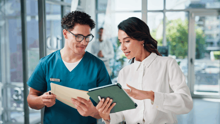 Doctors, conversation and people in hospital, tablet and teamwork with email for treatment approval. Employees, coworking and medical with healthcare, discussion and tech with results and schedule