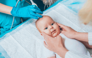 Doctor and little boy patient. Ultrasound equipment. Diagnostics. Sonography.
