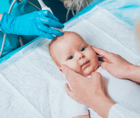 Doctor and little boy patient. Ultrasound equipment. Diagnostics. Sonography.
