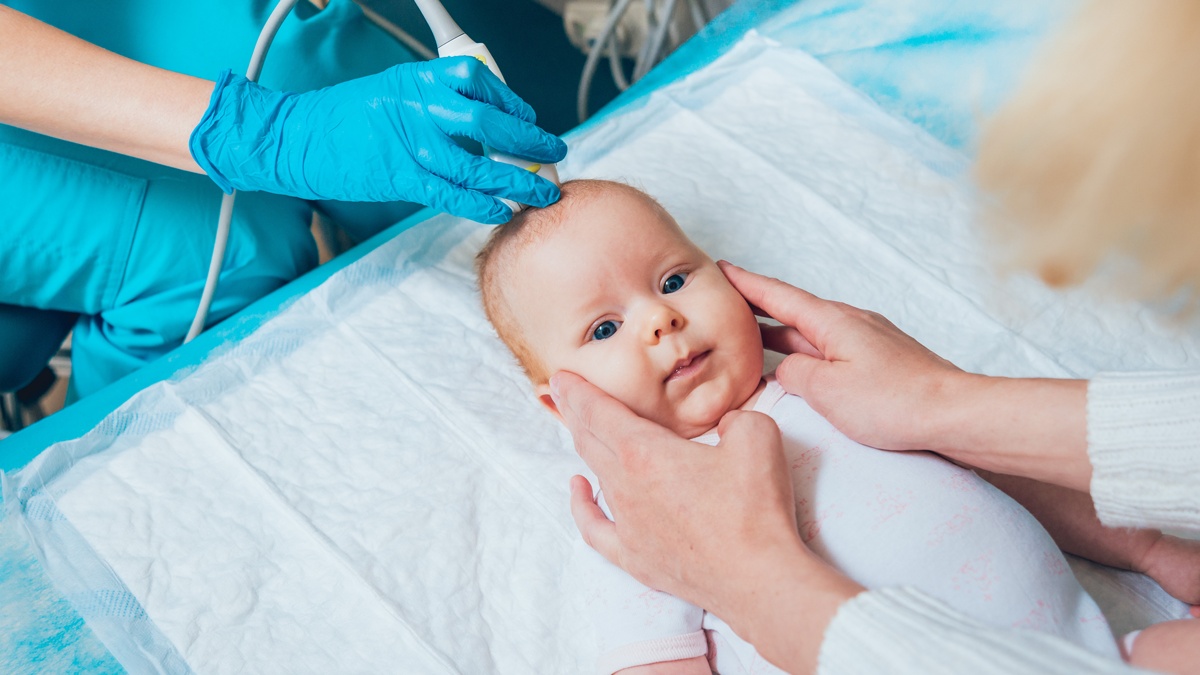 Doctor and little boy patient. Ultrasound equipment. Diagnostics. Sonography.