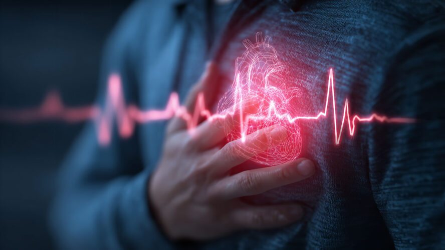A person clutching their chest with a glowing heart symbol indicating pain or health issue