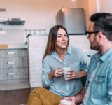 Cute couple talking indoors.
