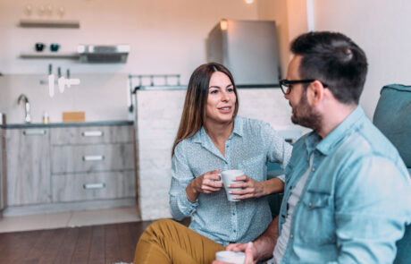 Cute couple talking indoors.