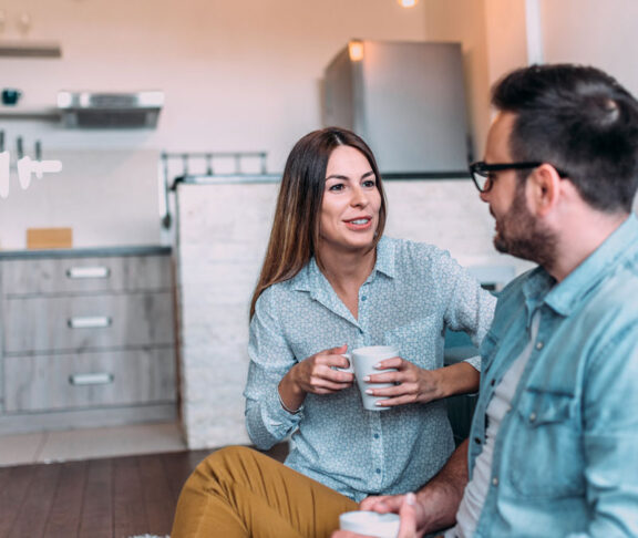 Cute couple talking indoors.