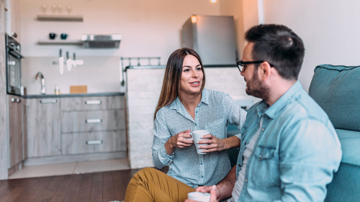 Cute couple talking indoors.
