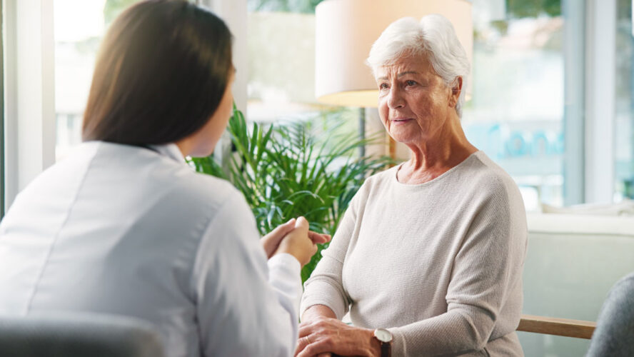 Doctor, senior woman and sad with talk for diagnosis, info or bad news for health services in retirement. Elderly person, stress and medical consultation with worry, listen or results at nursing home
