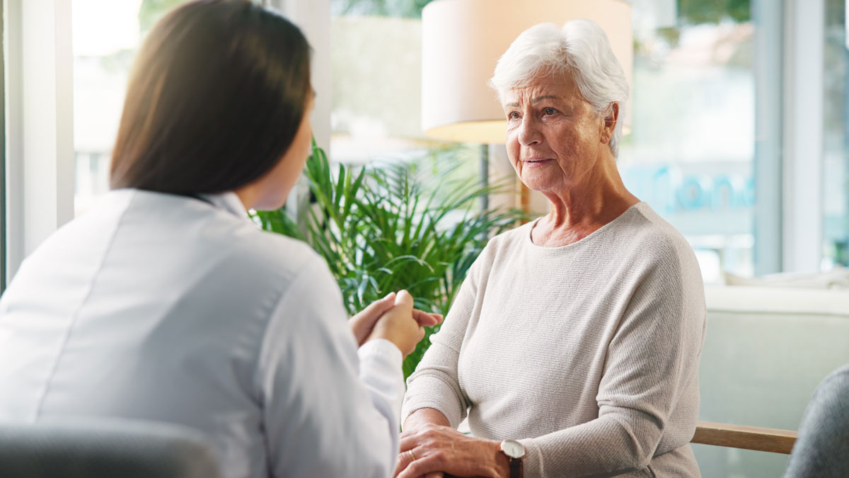 Doctor, senior woman and sad with talk for diagnosis, info or bad news for health services in retirement. Elderly person, stress and medical consultation with worry, listen or results at nursing home