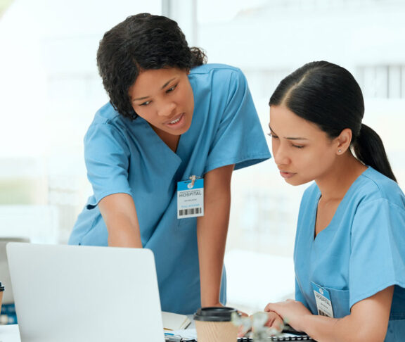 Doctors, women and laptop for research, brainstorming or internet with results, medical website or email. People, colleagues or nurses with pc, online reading or schedule for hospital ward or network